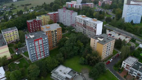 aerial drone shot of flat apartment complex in the middle of city during cloudy day