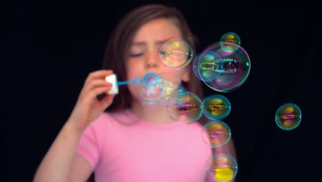 girl making bubbles in slow motion