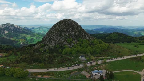 wide aerial shot around the mont gerbier de jonc, source of the loire river in ardeche, auvergne rhone alpes region, france