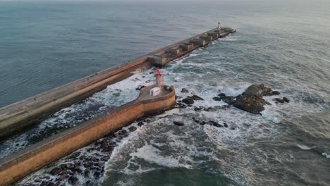 farolim de felgueiras stands tall on the picturesque coastline, porto - drone