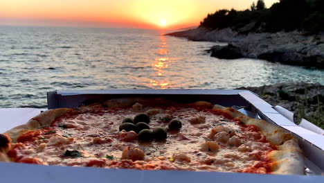 delicious scampi pizza on the water at the sunset in croatia