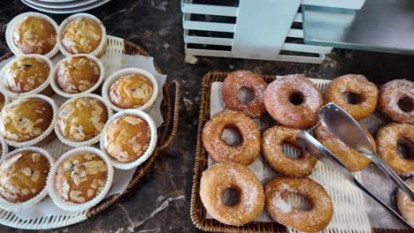breakfast buffet with donuts and muffins