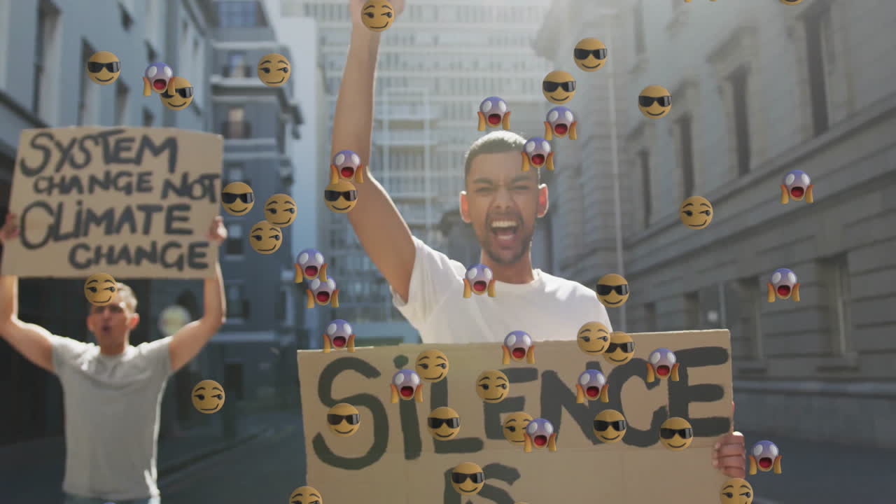 Two protesters raising fists, holding environmental signs in alley, featuring floating emoji icons