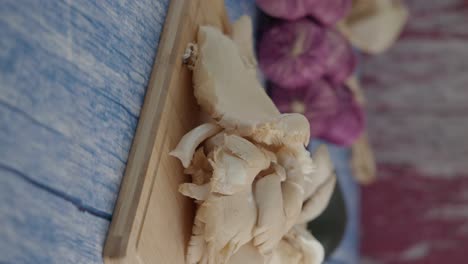 fresh mushrooms on a wooden cutting board