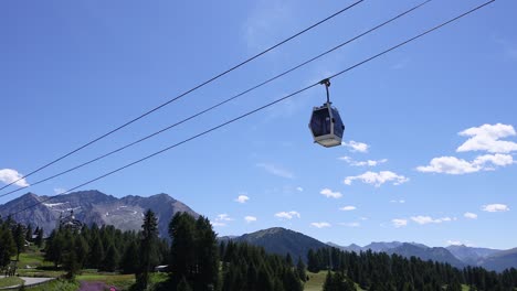 cable car moving over scenic mountain landscape