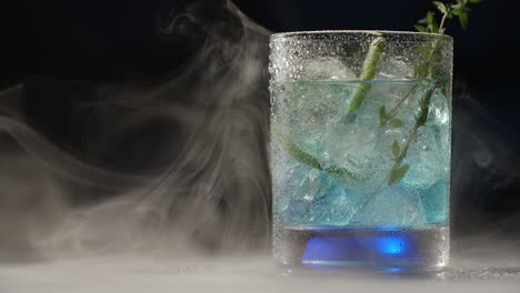blue cocktail with lime and ice