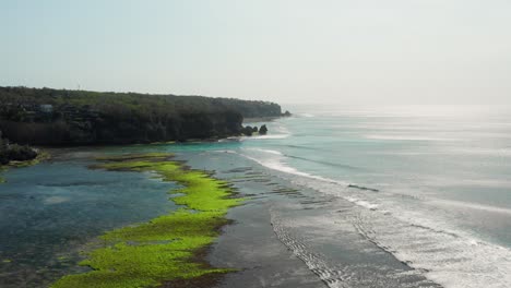 the town of bingin at the cliffs of uluwatu during low tide