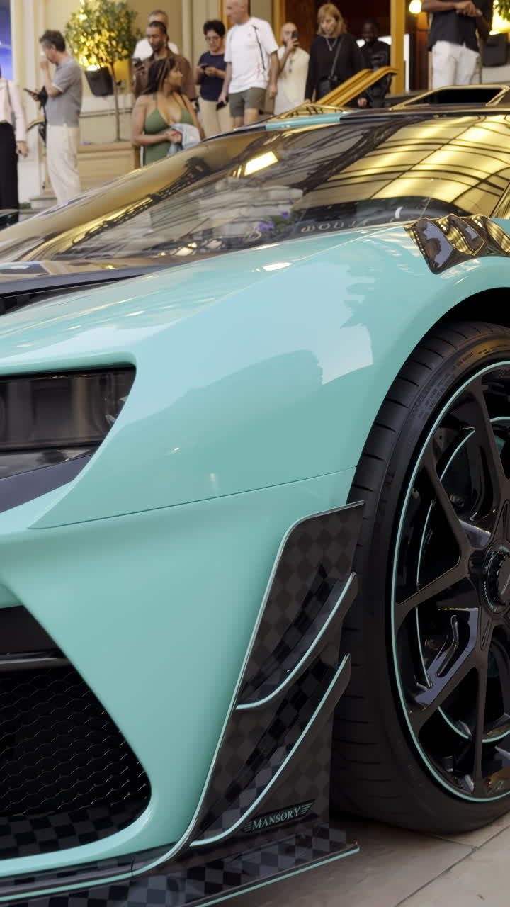Close-up of a Turquoise Luxury Supercar at a Public Event