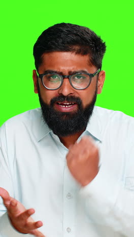 indian man hitting palm with fist showing readiness motivation determination act confident gesture