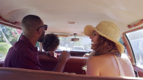 group of friends relaxing in car during road trip