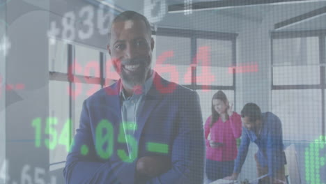 animation of stock market data processing against african american businessman smiling at office