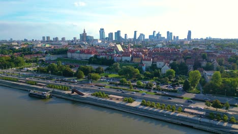 Aerial-panorama-of-Warsaw,-Poland-over-the-Vistual-river-and-City-center-in-a-distance-Old-town