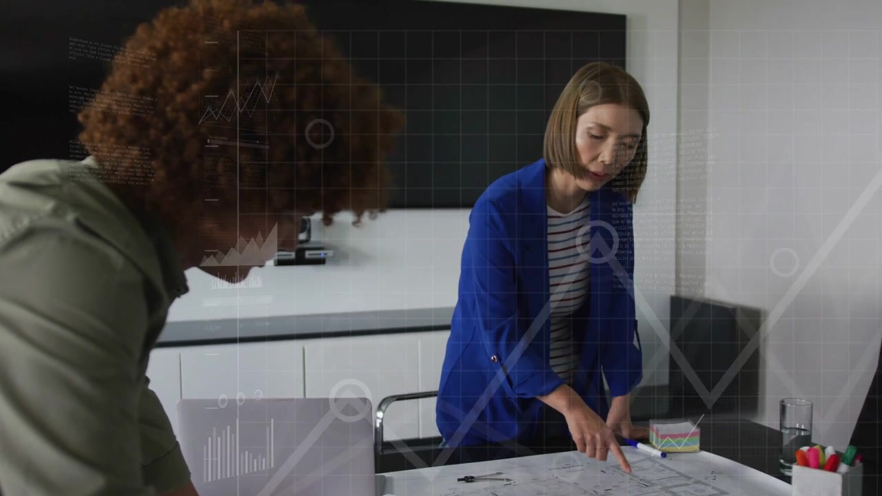 Woman pointing at plan, man leaning in, initiating animated data graphs for design review