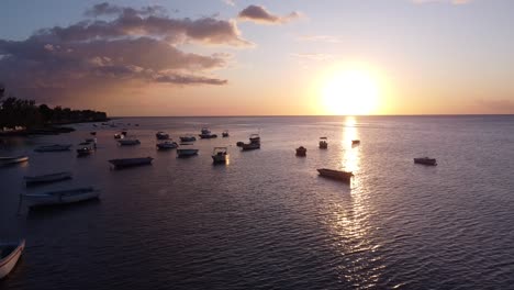 perfect sunset over the ocean and boats