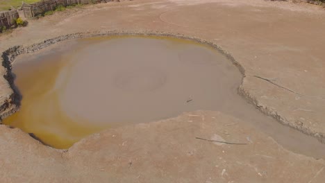 bunsee trace mud volcano aerial footage of mud bubbling up from the center of this wet type volcano in penal, trinidad