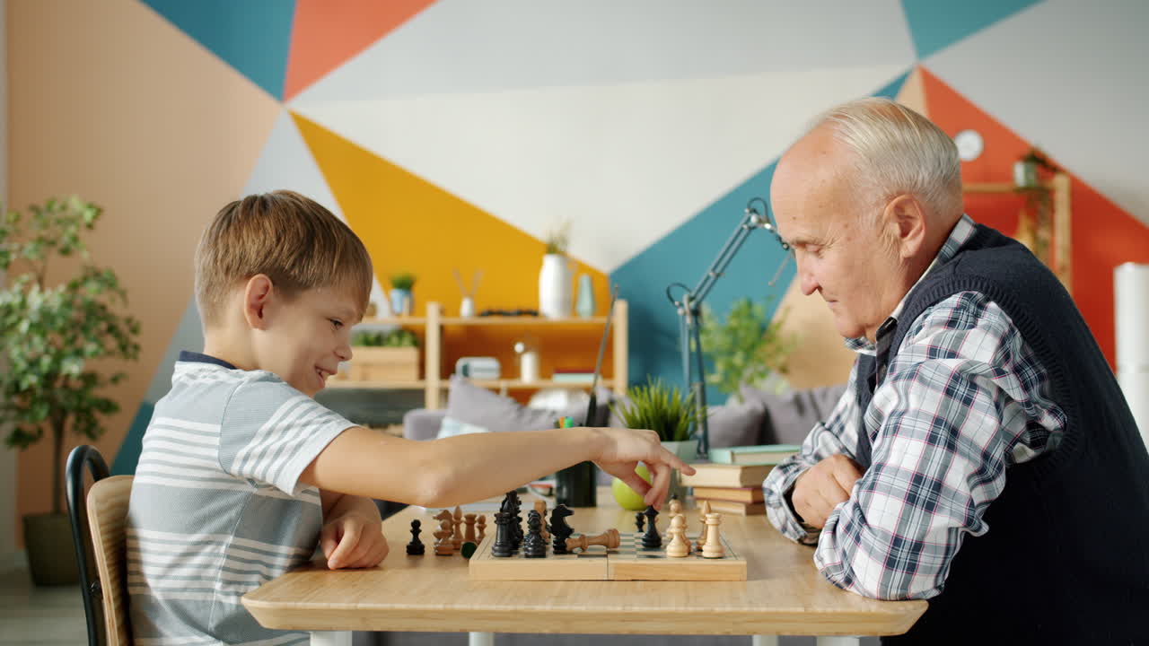 Grandfather and Grandson Playing Chess