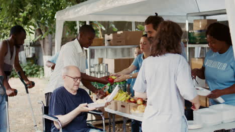 wheelchair-bound man receives food