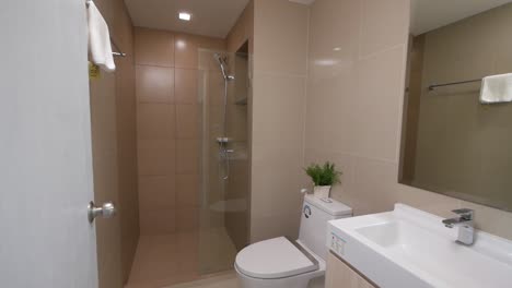 small white bathroom in an apartment- hotel room