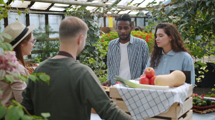 People Shopping at a Greenhouse Farmers Market