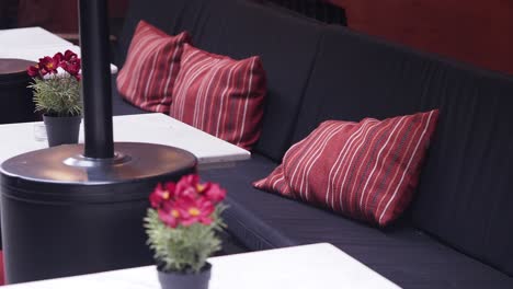 outdoor patio seating with red pillows