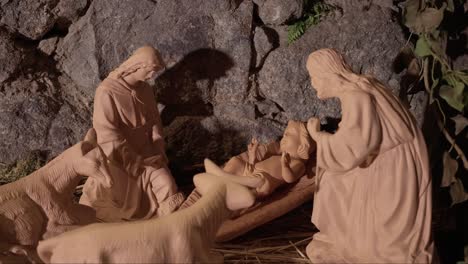 baby jesus with mary and joseph in a terracotta nativity scene