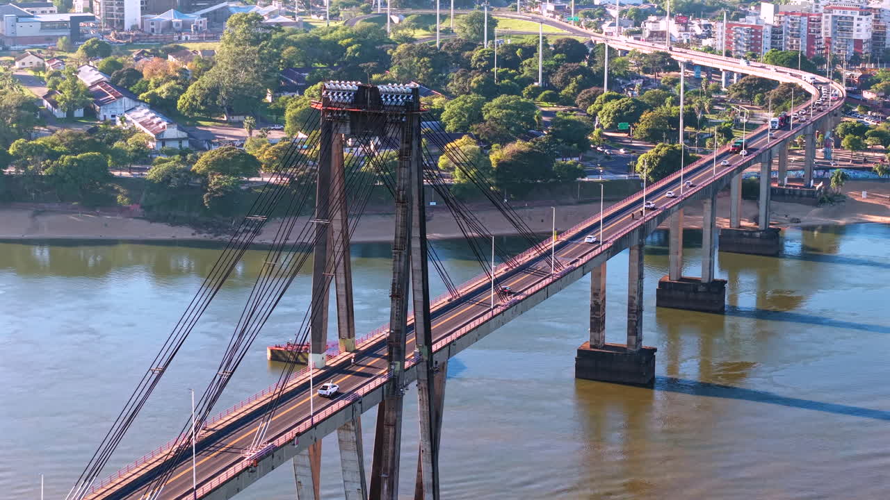 General Manuel Belgrano Bridge providing a vital transportation route across the Parana River in Corrientes, Argentina, showcasing civil engineering and urban connection, drone establishing shot