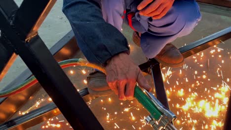 hand of worker hold and using cutting torch