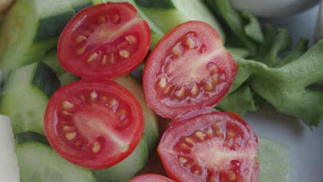 close-up shot of a fresh salad with tomatoes, cucumber and green salad