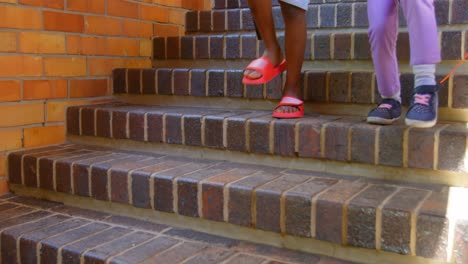 schoolkids walking down staircase of elementary school 4k