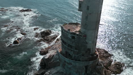 ruined lighthouse on rocky coastline