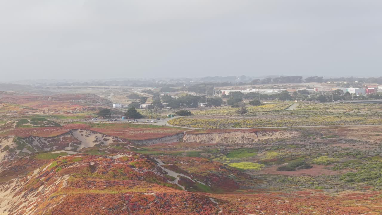 light casts long shadows on Fort Ord Beach as the drone captures the stillness of morning over coastal Marina.
