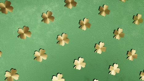 golden four-leaf clover on green background good luck 3d rendering animation endless looping vertical