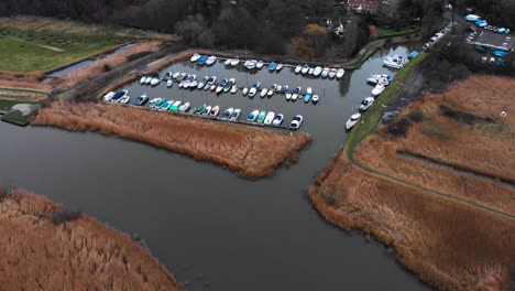 Aerial---Marina-on-River-Waveney,-Somerleyton,-England,-wide-backward-shot