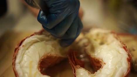 Close-Up---Preparing-boiled-New-Zealand-crayfish-split-in-halves