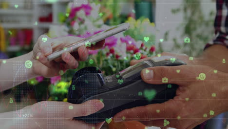 animation of data processing over caucasian woman who is paying with her phone
