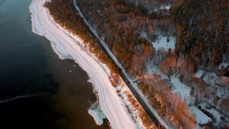 Beautiful-aerial-view-of-seaside-coastline-in-winter-at-sunrise,-sunset