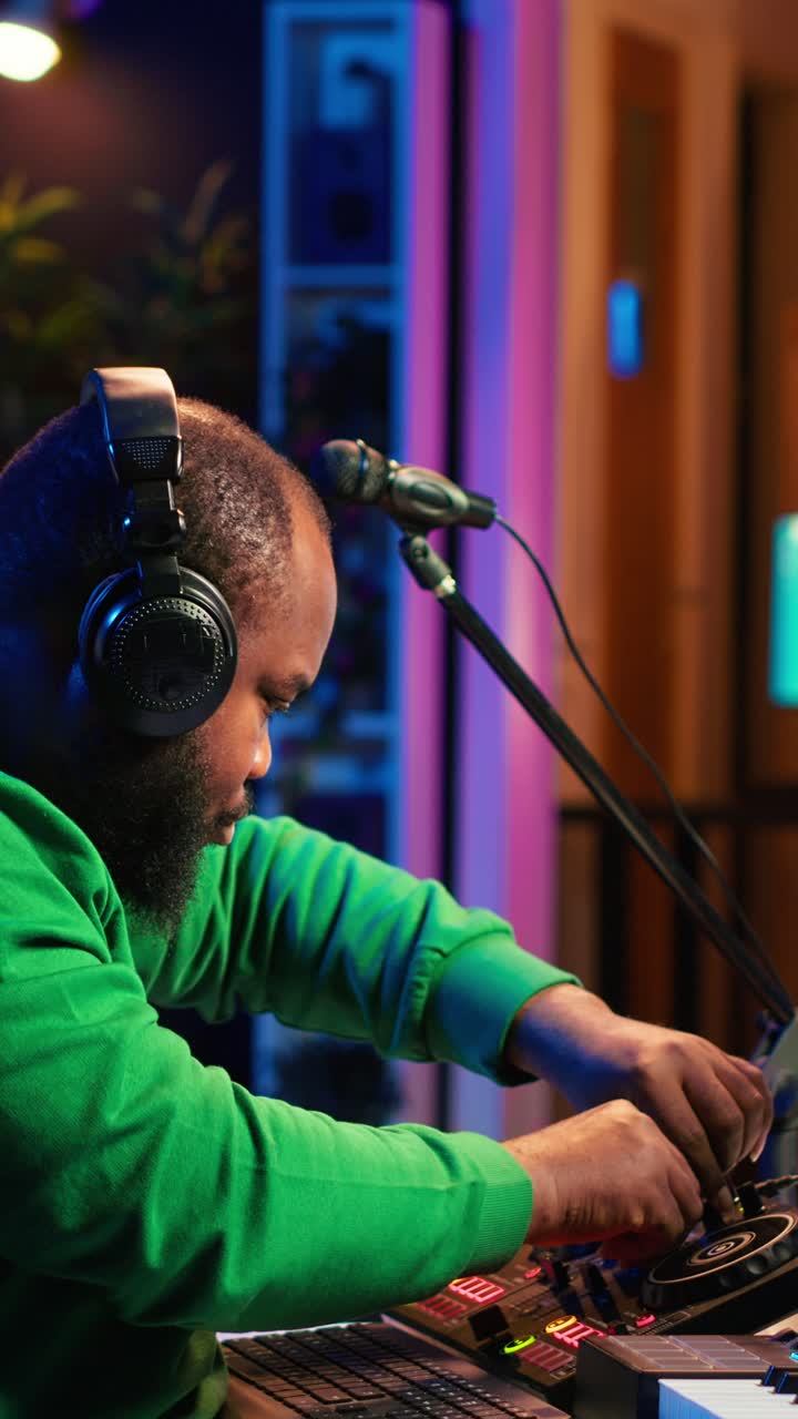 African American DJ Mixing Music in a Vibrant Home Studio