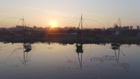 Aerial-view-of-serene-lake-at-sunrise