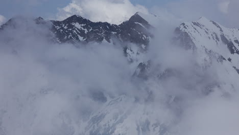 Time-lapse-of-clouds-moving-around-the-high-mountain-peaks-of-the-Wasatch-mountains-in-Utah