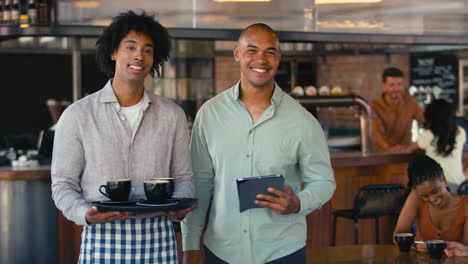 portrait of male staff team working in restaurant or coffee shop