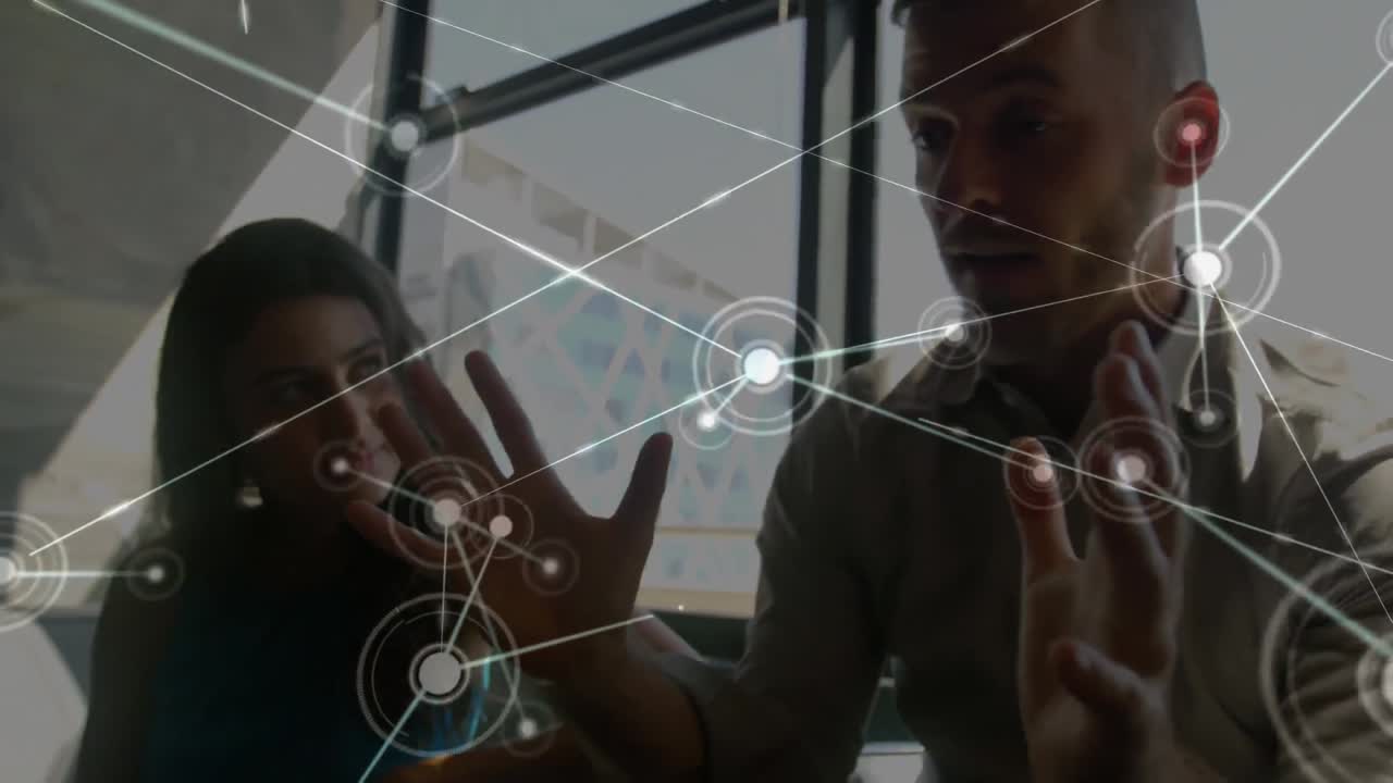 Animation of network of connections over team of diverse colleagues discussing together at office