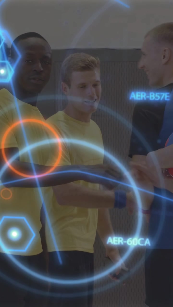 Vertical video: Two yellow players passing ball as blue player approaching, sports AR tagging zones