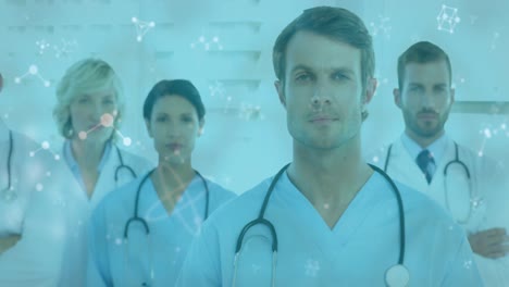 animación de redes de conexiones que se mueven sobre el retrato del equipo de un médico masculino y femenino