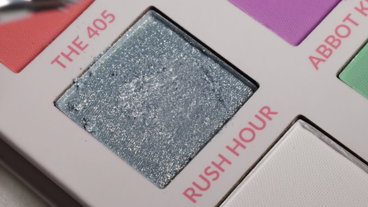 Shot of brush using eyeshadow from palette (rush hour).