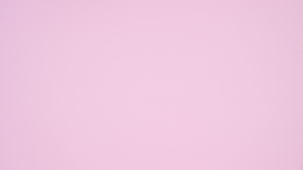 Christmas arrangement with gingerbread cookies and cupcakes on pastel pink theme. Stop motion