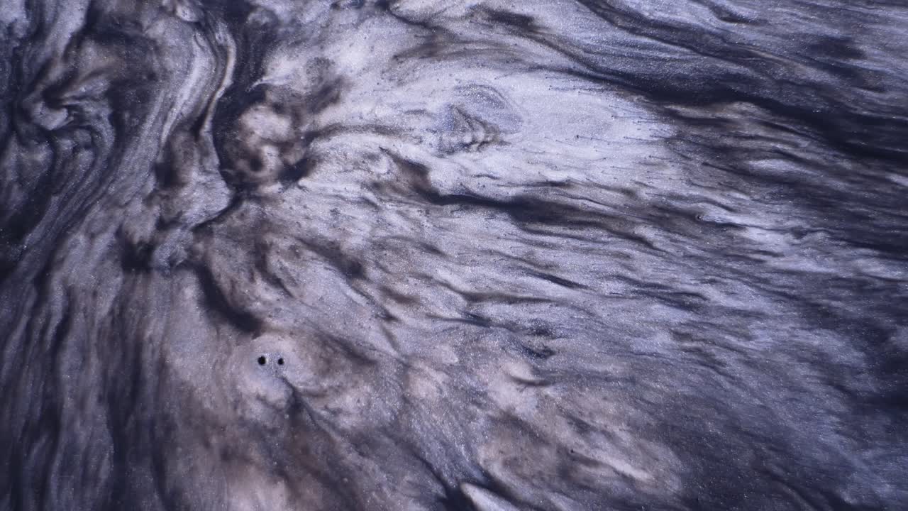 arte fluido abstracto con tonos negros y grises