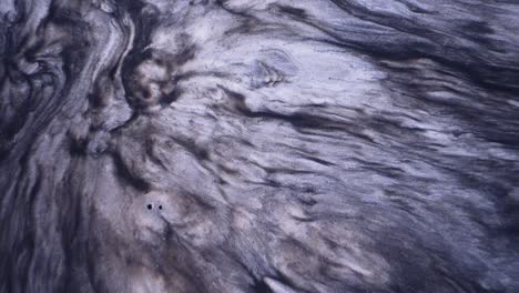 arte fluido abstracto con tonos negros y grises