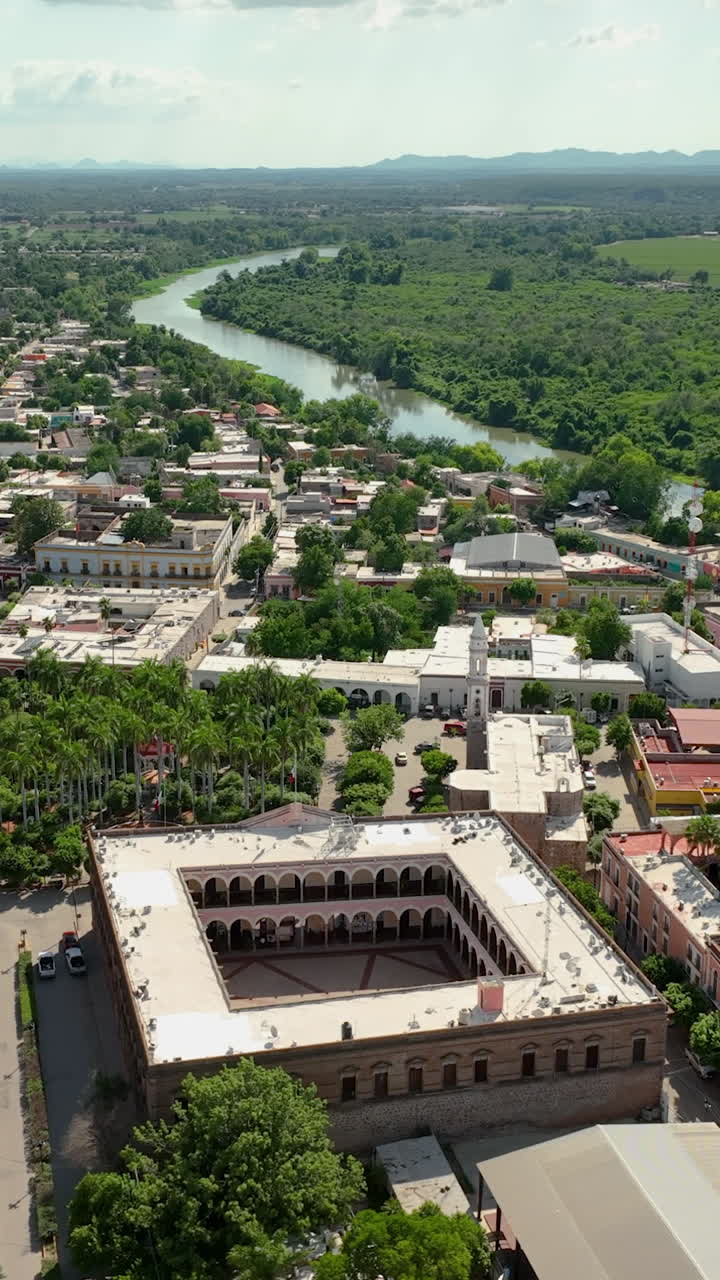 Vertical drone shot overlooking the downtown of El Fuerte, sunny Sinaloa, Mexico