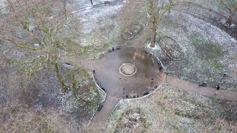 AERIAL---Russell-Square-during-a-snowy-winter-day,-London,-England,-wide-shot