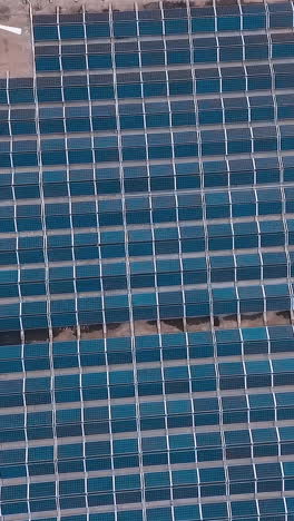 solar panels installed on roof. top down view of large area solar photovoltaic panels on rooftop
